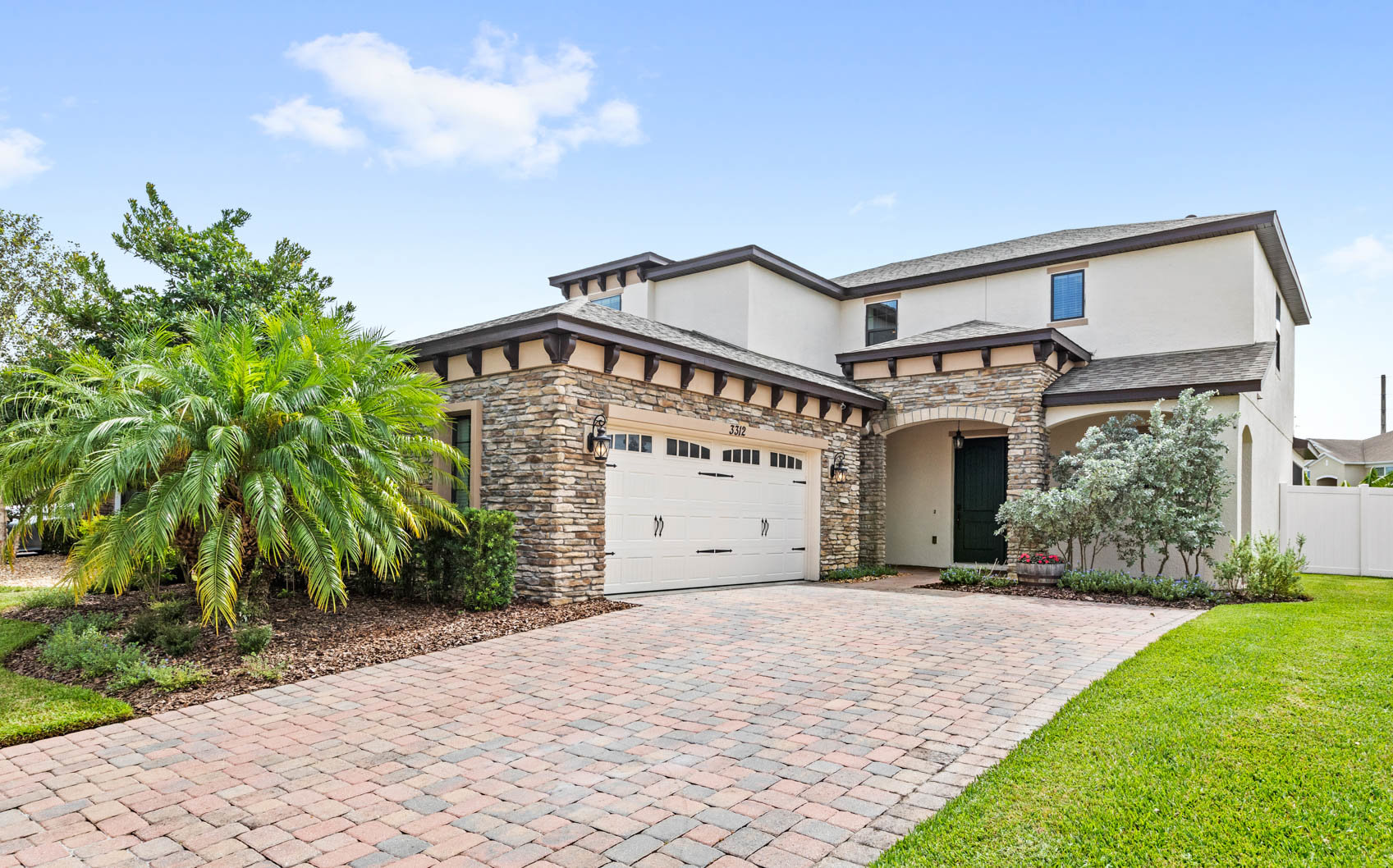 front of two story home with brown brick